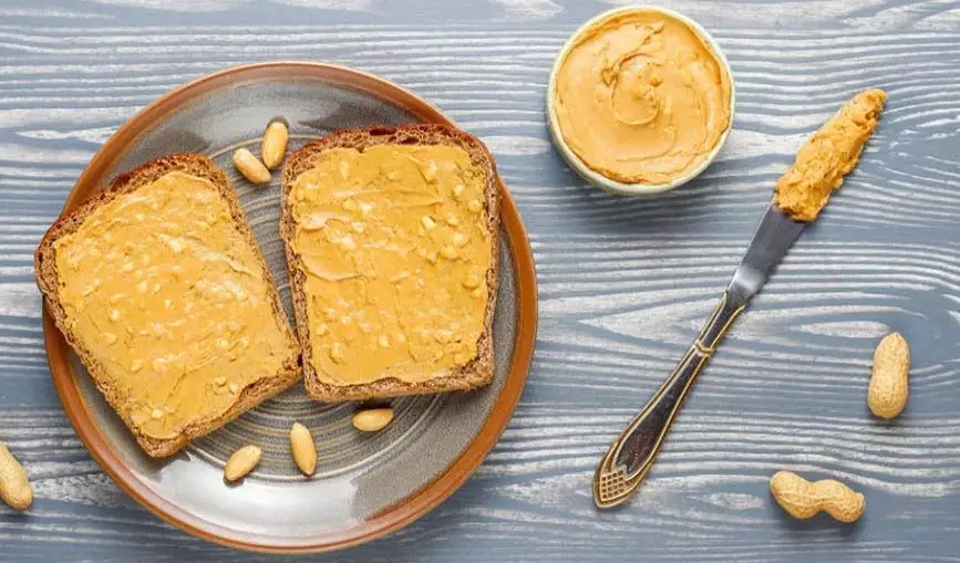 how much protein in a table spoon of peanut butter